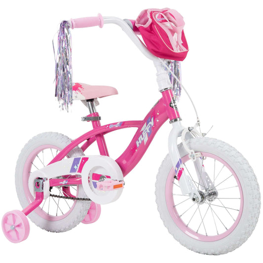 Pink children's bicycle with training wheels on a white background