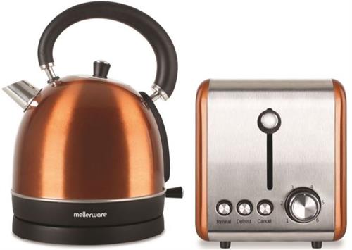 Copper kettle and silver toaster on a white background