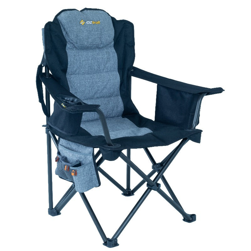 A blue OZtrail Big Boy Armchair with a steel frame, padded ripstop polyester fabric, insulated drink holder, and storage compartments.