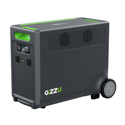 A black Gizzu Hero Ultra Plus 3840Wh portable power station with green accents, featuring output ports, a display, and wheels for mobility.