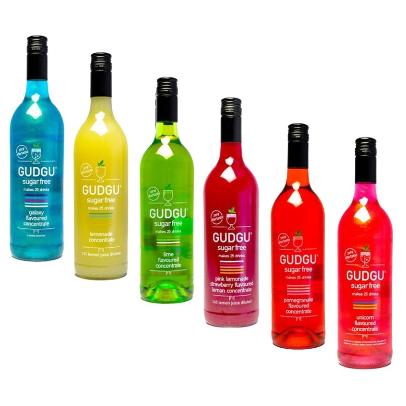 A collection of six GUDGU 750ml bottles in various colors, each representing a different flavor of sugar-free concentrate drink.