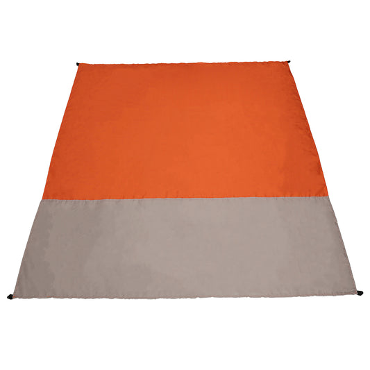 Two-toned orange and beige beach blanket on a white background