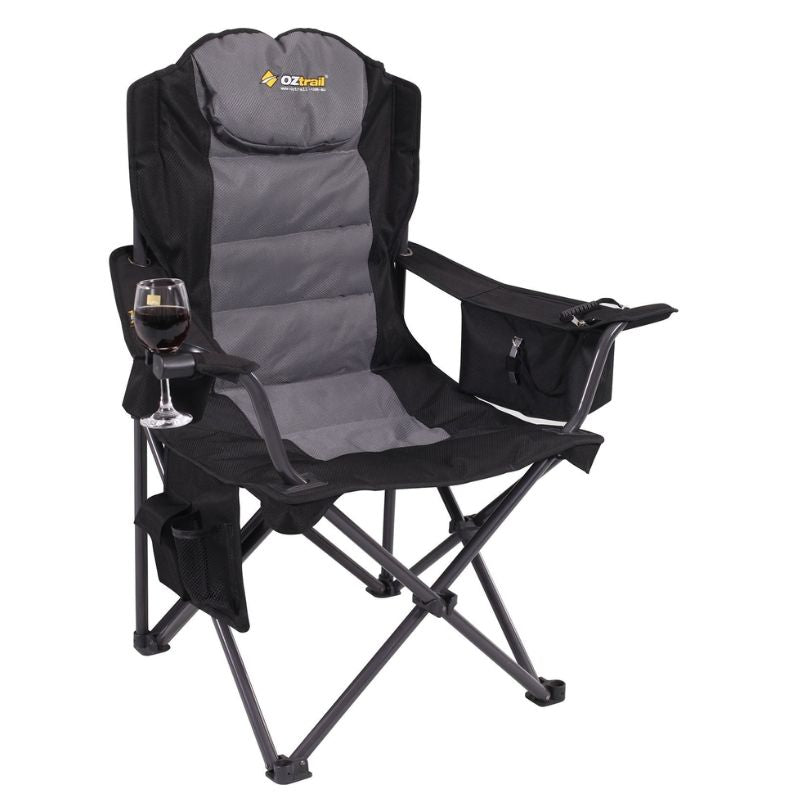A black and gray OZtrail Big Boy Armchair with a steel frame, padded ripstop polyester fabric, insulated drink holder, and storage compartments.