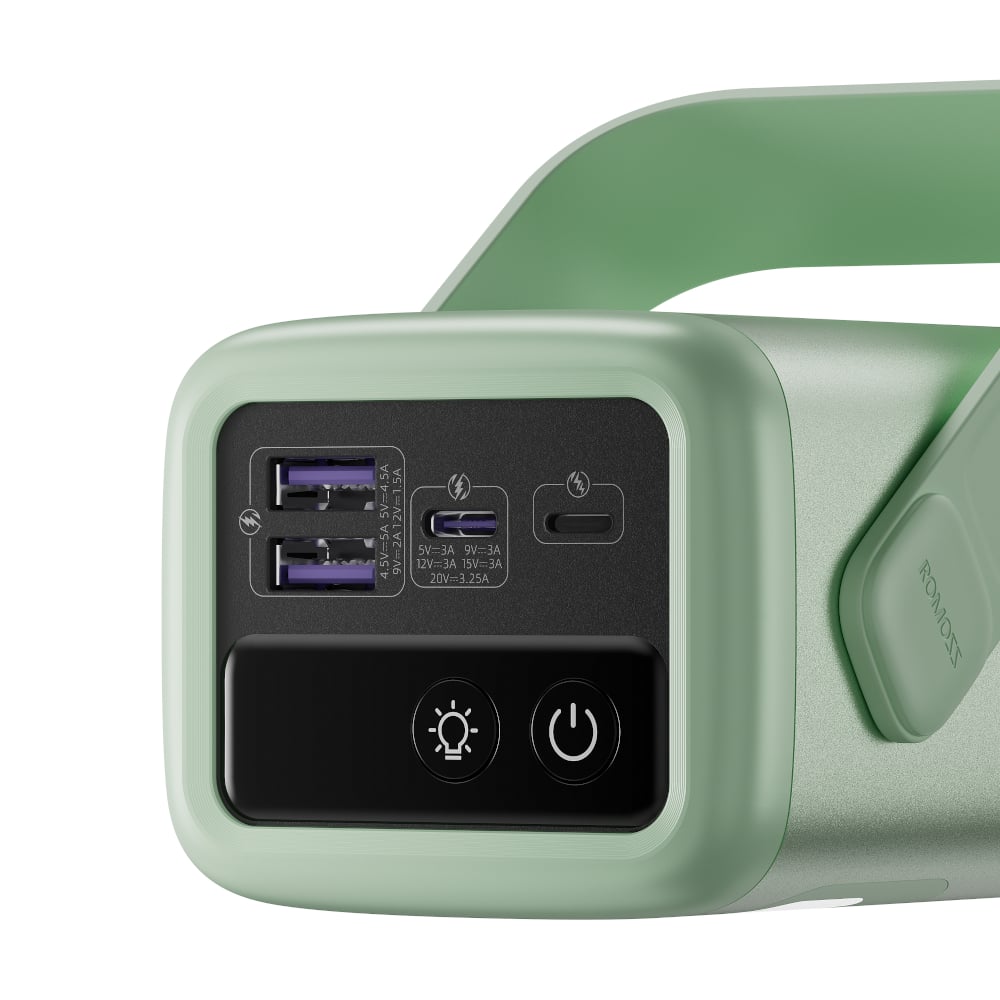 Close-up of a green power bank with USB ports and power button on a white background