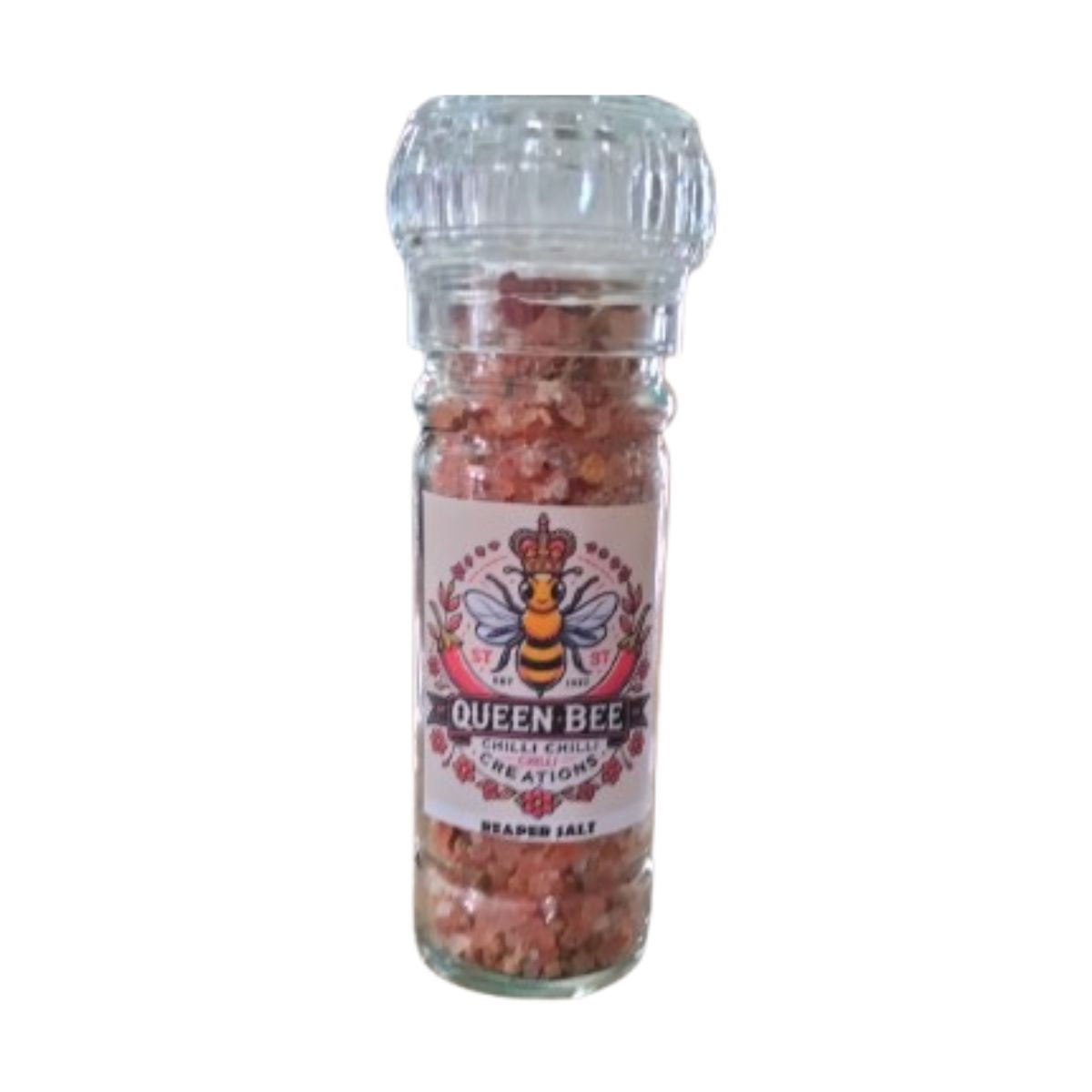 A clear glass grinder bottle with a label that reads 'Queen Bee Chilli Creations Reaper Salt', containing a blend of reaper chillies, salts and spices.