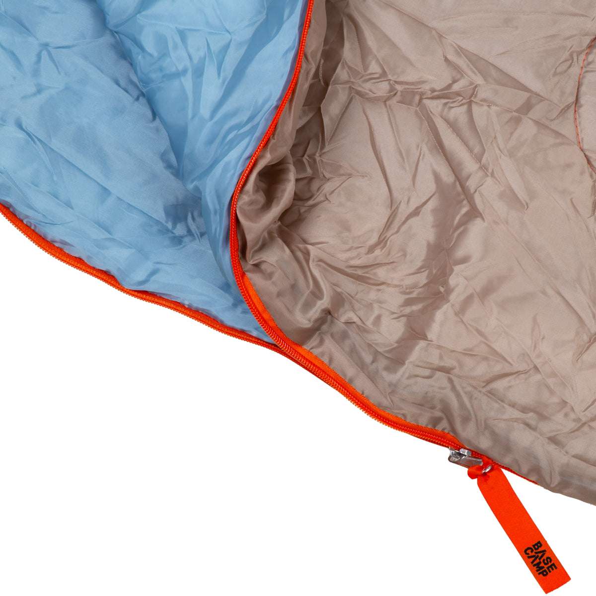 Close-up of a blue and brown sleeping bag with orange zipper on a white background