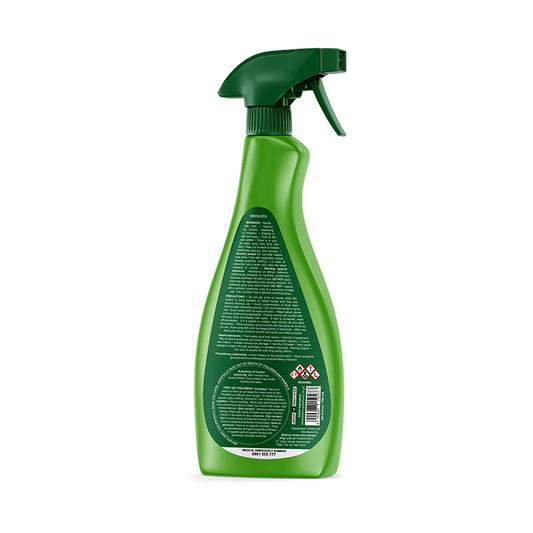 Green spray bottle with a label on a white background