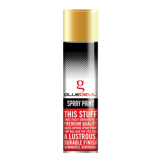 Spray paint can with gold cap and red text on a white background