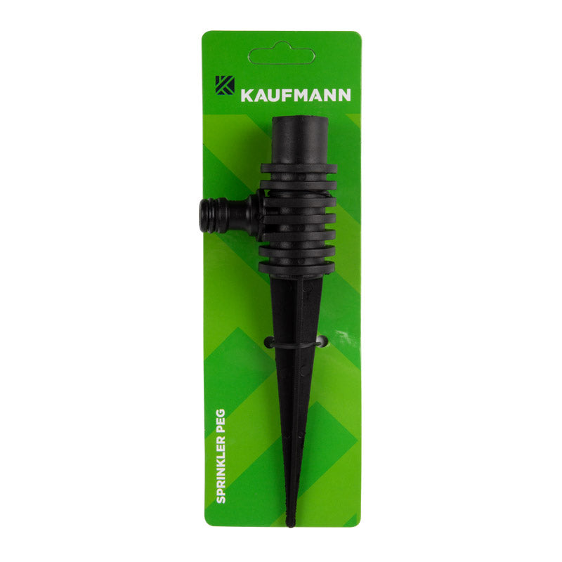 A black plastic sprinkler peg with a coupling device, mounted on a green blister pack with the Kaufmann brand logo.