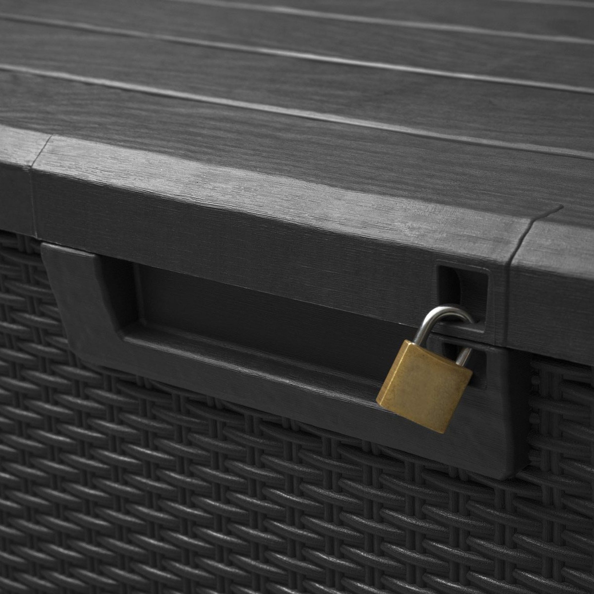 Black storage box with a gold padlock on a wooden surface