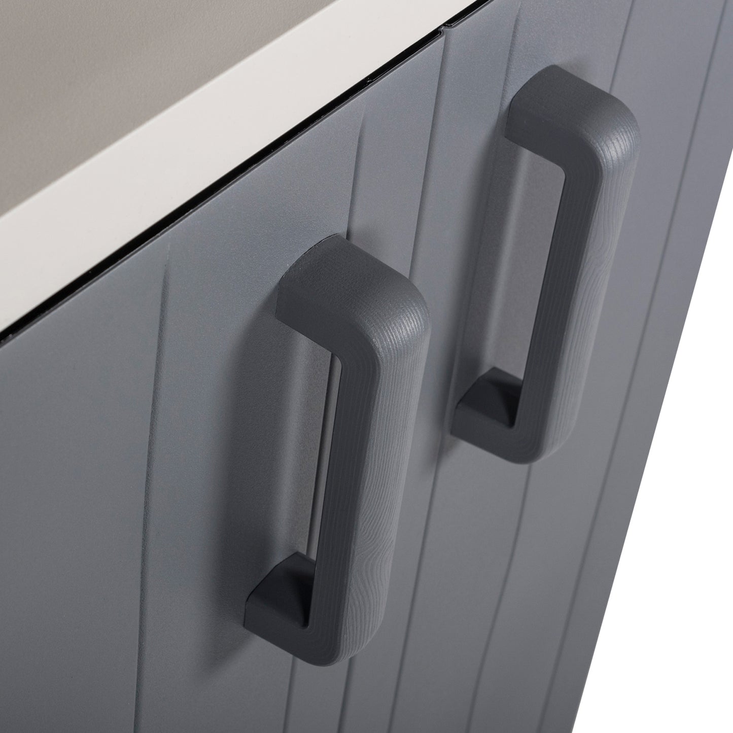 Close-up of gray cabinet doors with handles on a white background