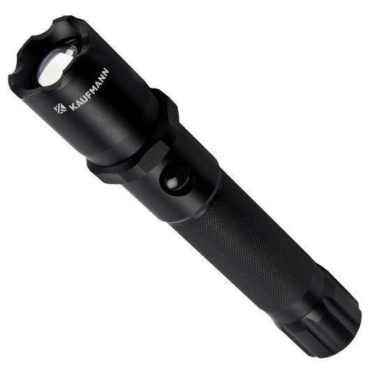A black Kaufmann T650 LED flashlight with an adjustable focus feature, designed for outdoor use and emergencies.