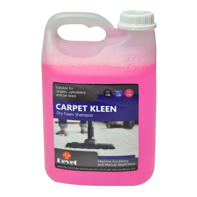 A pink plastic bottle of Revet Carpet Kleen dry foam shampoo, which is designed for cleaning carpets and upholstery.