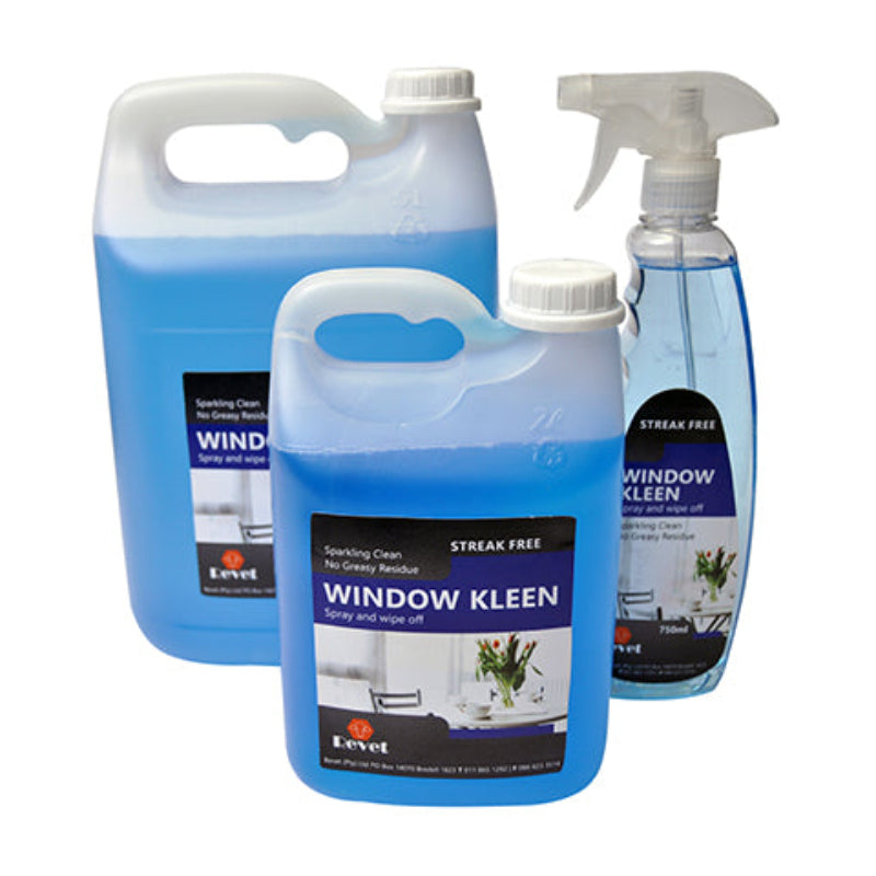 Three bottles of Revet Window Kleen window cleaner in different sizes, with the largest one standing upright and the smaller two lying down, accompanied by a spray bottle.