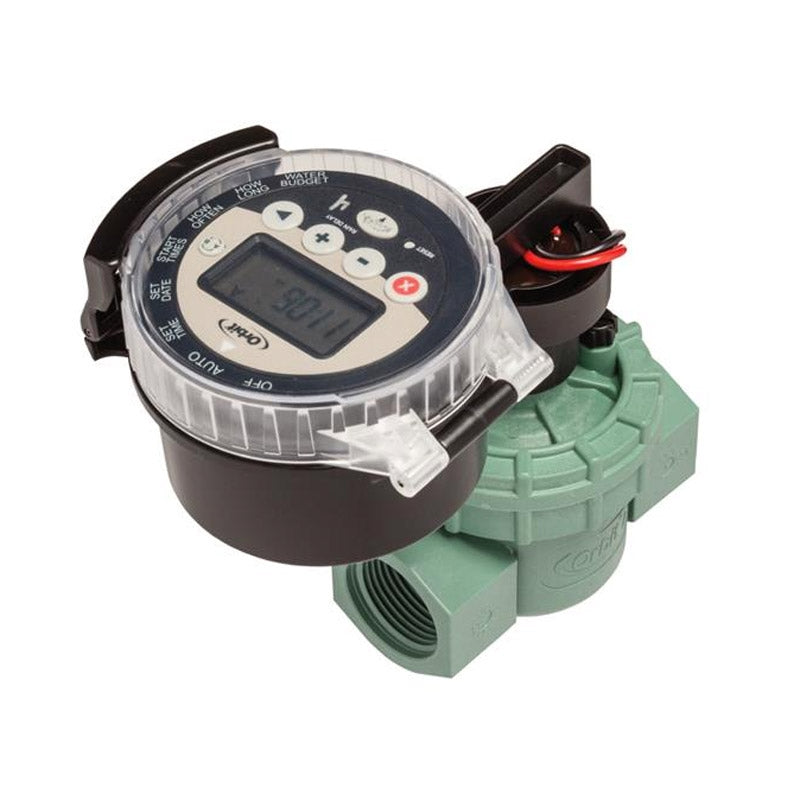 An Orbit battery-operated sprinkler controller with in-line valve, featuring a digital screen and dial interface, mounted on a green valve.