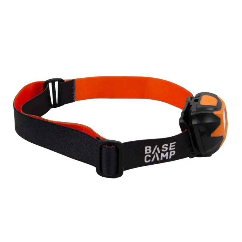 Black and orange headlamp with 'Base Camp' branding on a white background