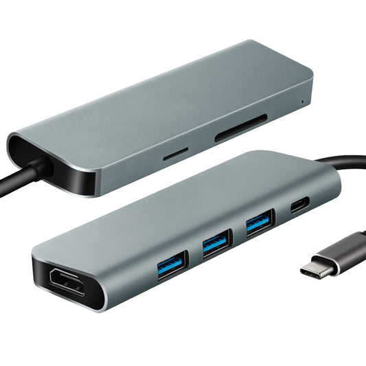 A gray Parrot 7-in-1 USB Type-C Hub with multiple ports, including USB-A and HDMI, with a connected cable.