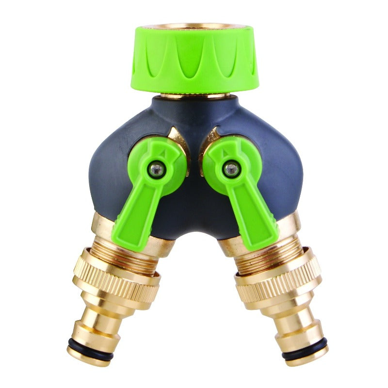 A Gro Deluxe 2-Way Tap Adapter with green valves and a gray body, featuring brass connectors for garden hoses.