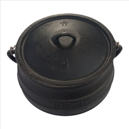 Black pot with lid on a white background