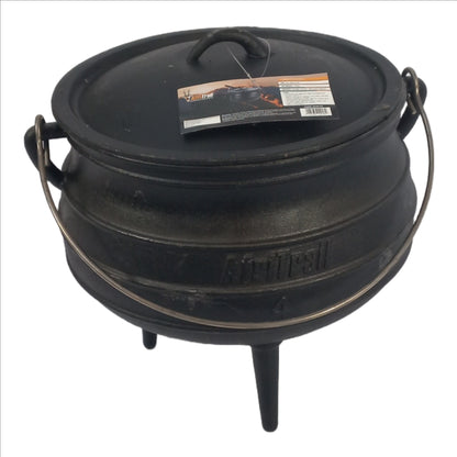 Black cast iron pot with lid on a white background