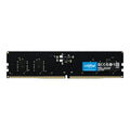 A Crucial by Micron DDR5 desktop memory module with a row of silver-colored contact points on one side.