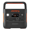 A portable power station with Jackery branding, featuring multiple power outlets, a carrying handle, and a digital display.