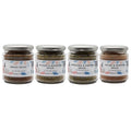 Four jars of Fox & Jackal spice blends, labeled Braai Spice, Orange & Rosemary Spice, Oregano & Pepper Spice, and Thyme & Paprika Spice, arranged side by side.