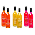 A collection of GUDGU sugar-free concentrate bottles in various colors representing different flavors.
