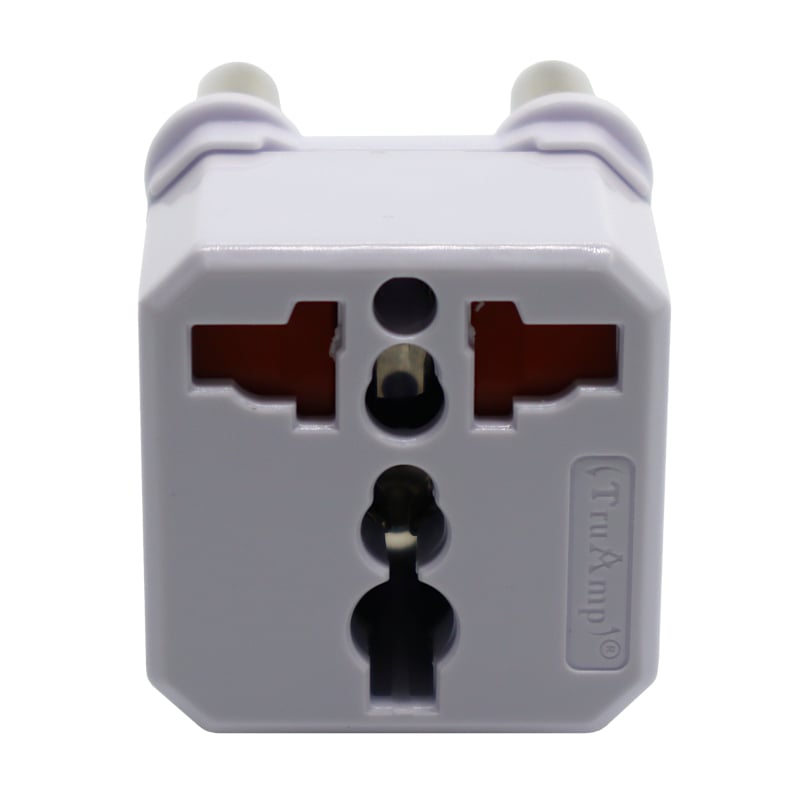 White travel adapter with multiple sockets on a white background