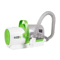 A Gizzu pet vacuum grooming kit with a white body, green accents, and an attached hose.