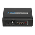 A black 2-Port HDMI Splitter with the text '2-HDMI Splitter' on top and an input port labeled 'Copy Auto Power' along with a red indicator light. It has two HDMI ports and a power input button.