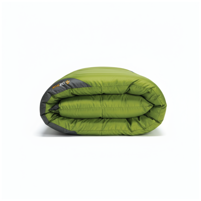 Folded green sleeping bag with black accents on a white background