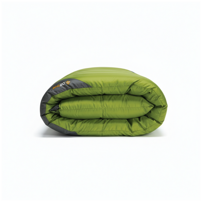 Folded green sleeping bag with black accents on a white background