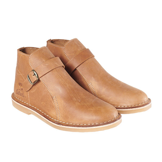 A pair of tan, full grain wax leather ladies boots with small buckle and stitched down construction.