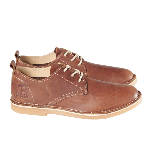 A pair of brown, BATA Safari Woodlands ladies' shoes with a low cut style, featuring a lace-up closure and a flat sole.