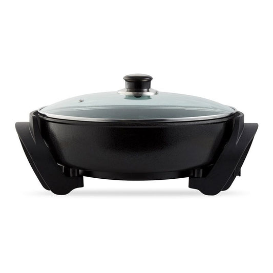 Mellerware electric frying pan with a black non-stick coating, round in shape, with a glass lid on top and a handle on the side.