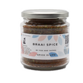 A jar of Fox & Jackal Braai Spice with a label that includes the product name and information such as 'Gluten-free', 'No artificial colours or flavours', and 'Suitable for Vegetarians and Vegans'.