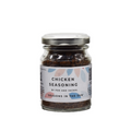 A glass jar of Fox & Jackal Chicken Seasoning with a label that includes caraway and sage illustrations, indicating gluten-free and suitable for vegetarians and vegans.