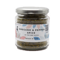 A glass jar containing Oregano & Pepper Spice by Fox & Jackal, with a label that includes the brand name and the product name, placed on a white background.