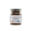 A glass jar containing Provençal herb seasoning by Fox and Jackal, labeled 'Seasons in the Sun'.